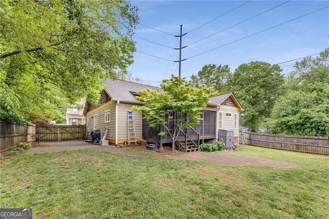 72 Griggs St SW, Marietta, GA 30064 - fenced backyard with a patio area and a sunroom