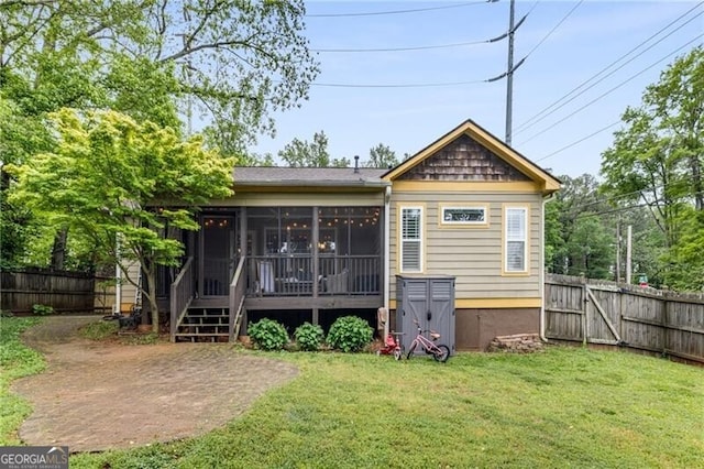 72 Griggs St SW, Marietta, GA 30064 - rear view of house with a sunroom and a fenced backyard