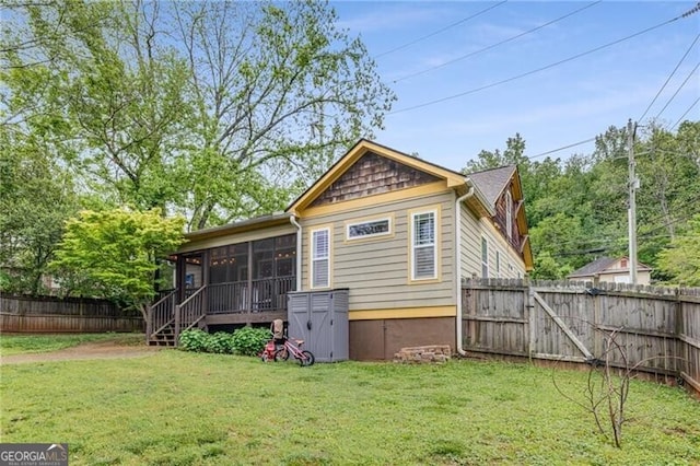 72 Griggs St SW, Marietta, GA 30064 - rear view of house featuring a sunroom and a fenced backyard