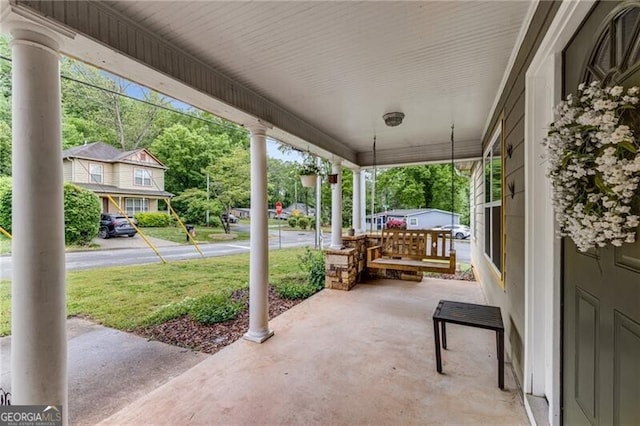 72 Griggs St SW, Marietta, GA 30064 - covered porch featuring a lawn