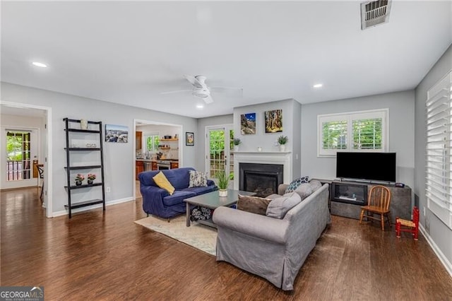 72 Griggs St SW, Marietta, GA 30064 - living room with a glass covered fireplace, dark wood finished floors, ceiling fan, and recessed lighting