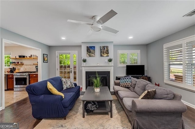 72 Griggs St SW, Marietta, GA 30064 - living room featuring healthy amount of natural light, recessed lighting, a fireplace, ceiling fan, and dark wood-type flooring