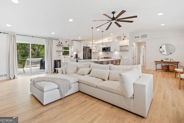 369 Arnold Mill Rd, Woodstock, GA 30188 - living area featuring light wood-style floors, visible vents, a ceiling fan, and lofted ceiling
