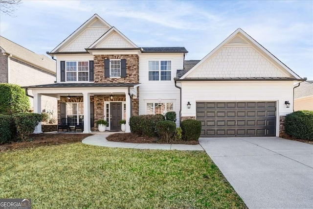 3125 Crooked Stick Dr, Cumming, GA 30041 - view of front of house featuring a garage, driveway, stone siding, and a front lawn