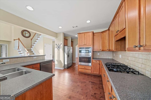 3125 Crooked Stick Dr, Cumming, GA 30041 - kitchen with tasteful backsplash, a sink, visible vents, appliances with stainless steel finishes, and dark wood-style floors