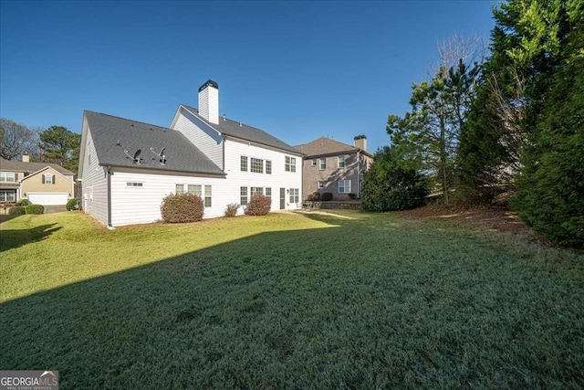 3125 Crooked Stick Dr, Cumming, GA 30041 - rear view of house featuring a chimney and a yard