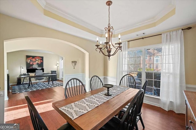 3125 Crooked Stick Dr, Cumming, GA 30041 - dining room featuring a raised ceiling, crown molding, and a notable chandelier