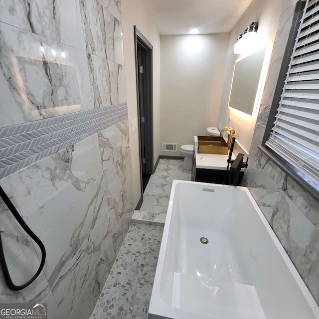 2704 Terratim Ln, Decatur, GA 30034 - bathroom with marble finish flooring, vanity, toilet, and a tub to relax in