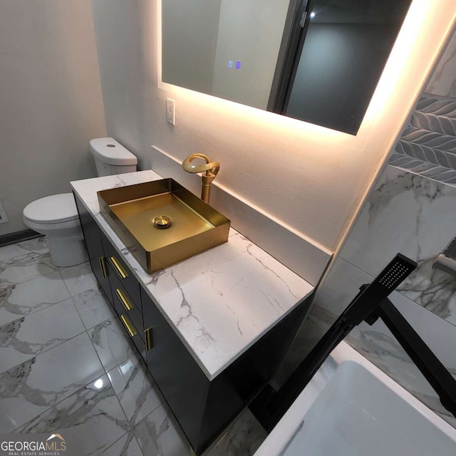 2704 Terratim Ln, Decatur, GA 30034 - bathroom featuring marble finish floors, toilet, and vanity