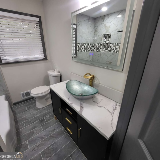 2704 Terratim Ln, Decatur, GA 30034 - bathroom with vanity, toilet, a shower, and marble finish floors