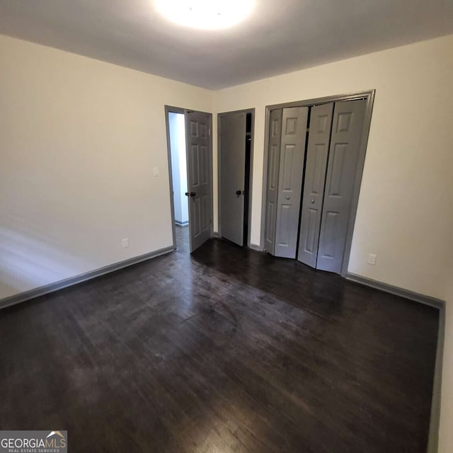 2704 Terratim Ln, Decatur, GA 30034 - unfurnished bedroom featuring dark wood-type flooring and baseboards