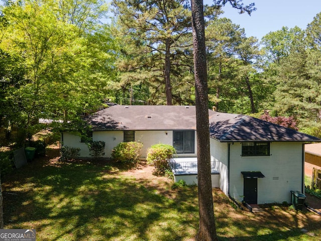 2704 Terratim Ln, Decatur, GA 30034 - back of property featuring brick siding, a lawn, and a shingled roof