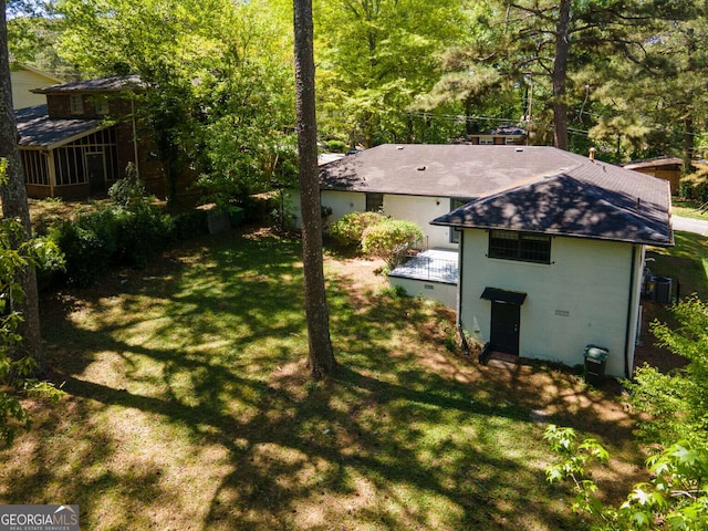 2704 Terratim Ln, Decatur, GA 30034 - view of grassy yard with a sunroom and a wooden deck