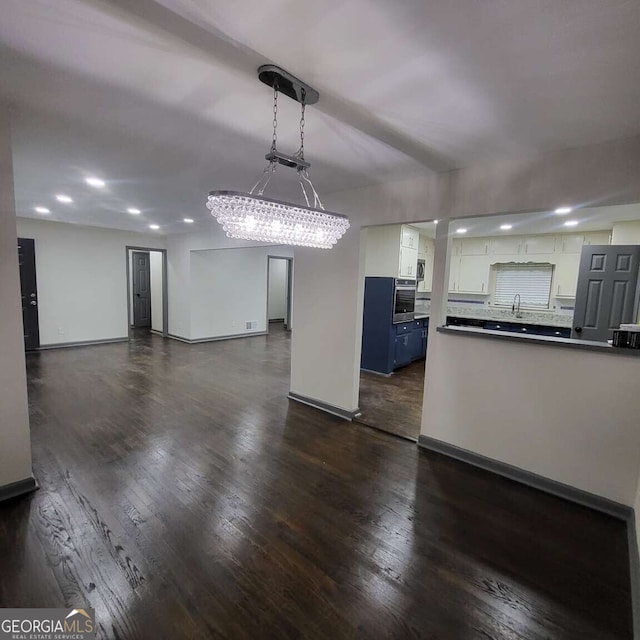 2704 Terratim Ln, Decatur, GA 30034 - unfurnished living room with dark wood-type flooring, baseboards, a chandelier, and recessed lighting