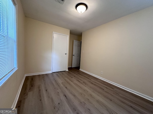 7336 Howard Cir, Jonesboro, GA 30236 - unfurnished bedroom featuring wood finished floors and baseboards