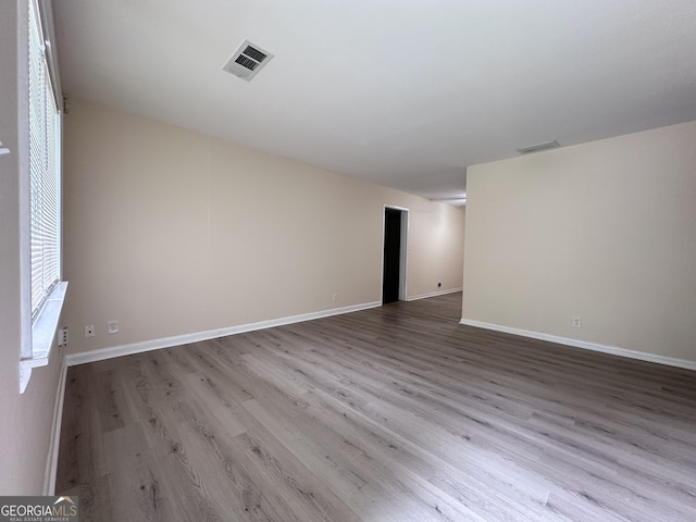 7336 Howard Cir, Jonesboro, GA 30236 - unfurnished room featuring wood finished floors, visible vents, and baseboards