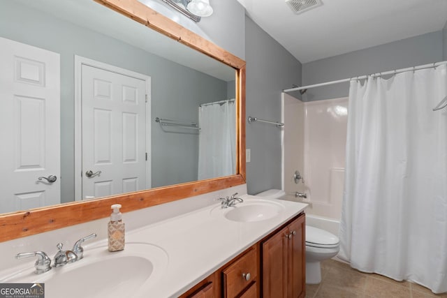 full bath with visible vents, toilet, tile patterned flooring, and a sink