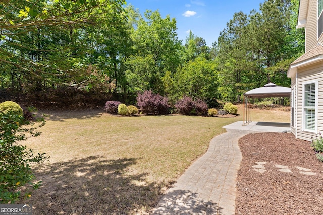 view of yard with a patio and a gazebo