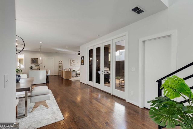 interior space with visible vents, french doors, wood finished floors, and recessed lighting