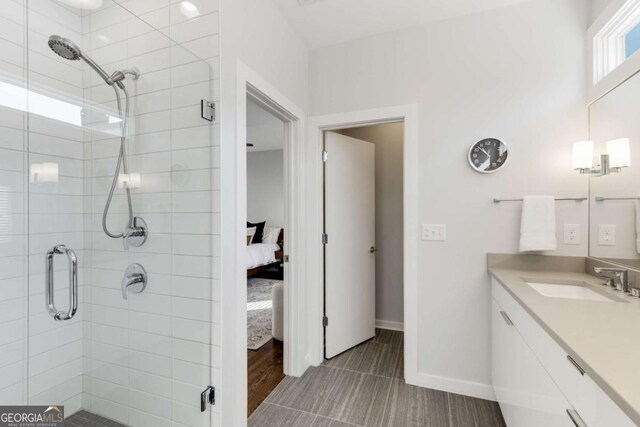 ensuite bathroom with ensuite bath, vanity, and a shower stall
