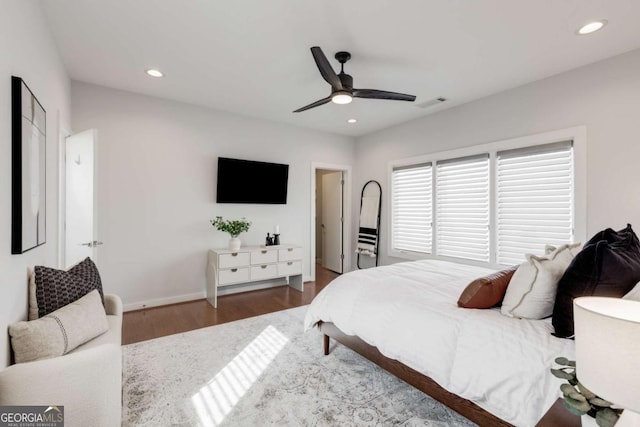 bedroom featuring wood finished floors, visible vents, and recessed lighting