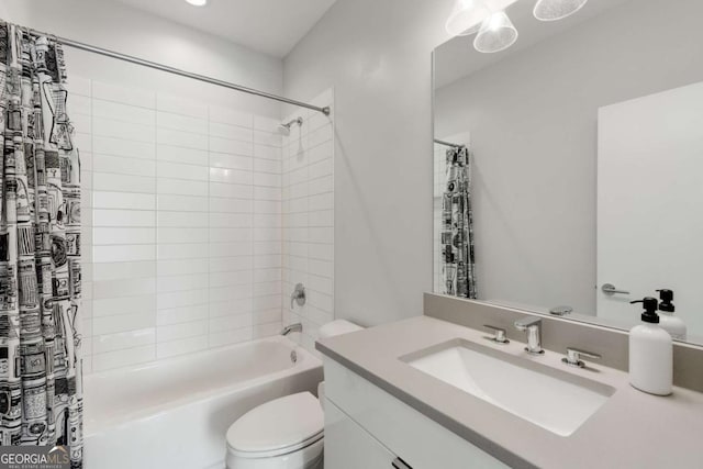 full bathroom featuring shower / bath combo with shower curtain, toilet, and vanity