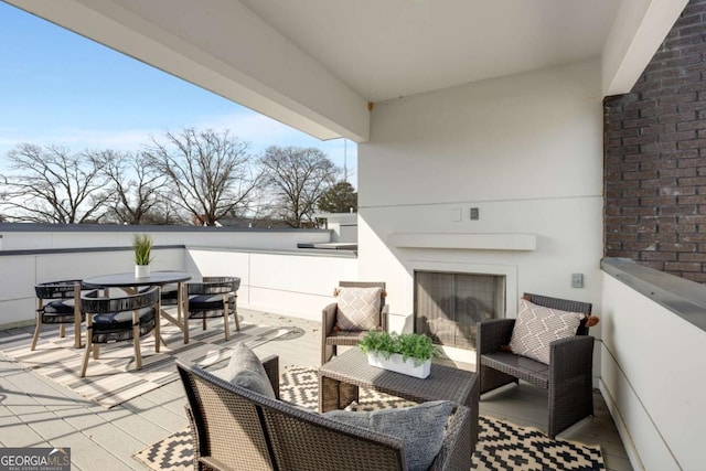 view of patio / terrace featuring outdoor dining area and a balcony
