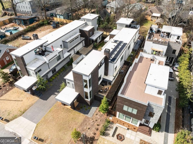 birds eye view of property with a residential view