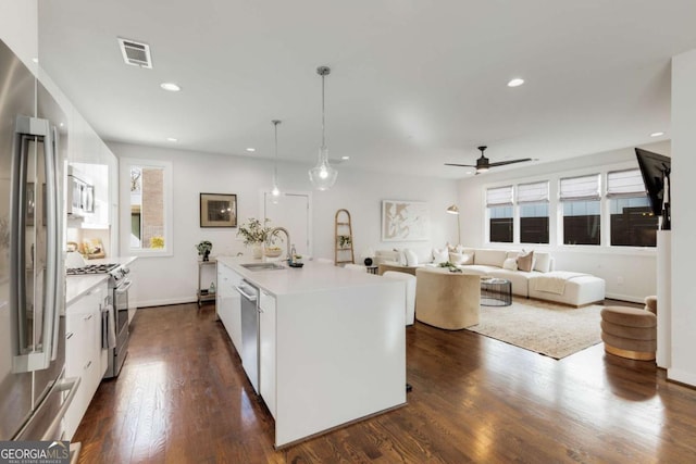 kitchen featuring light countertops, visible vents, a sink, appliances with stainless steel finishes, and ceiling fan