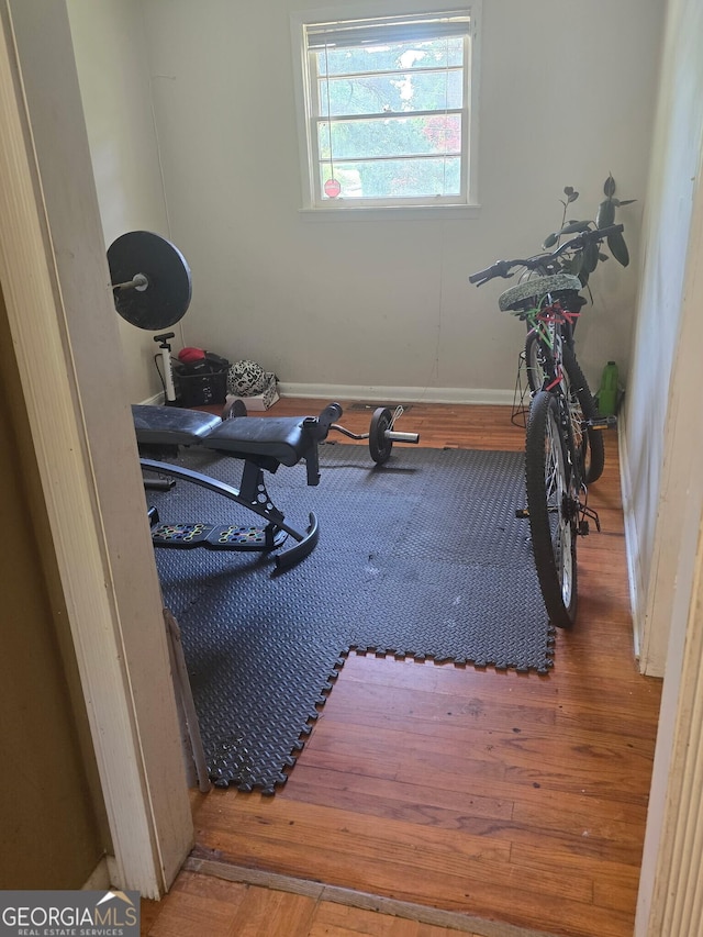 100 Brookwood Dr, Warner Robins, GA 31088 - workout room featuring baseboards and wood finished floors