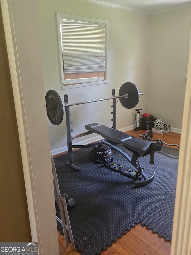 100 Brookwood Dr, Warner Robins, GA 31088 - exercise area with baseboards, wood finished floors, and crown molding