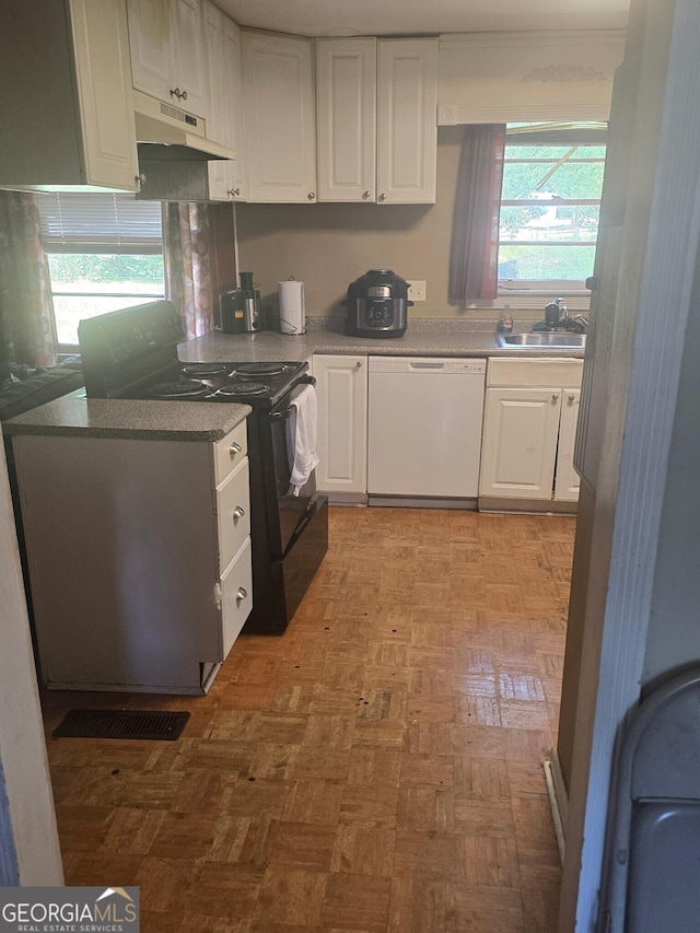 100 Brookwood Dr, Warner Robins, GA 31088 - kitchen featuring under cabinet range hood, white dishwasher, a sink, white cabinetry, and black range with electric cooktop