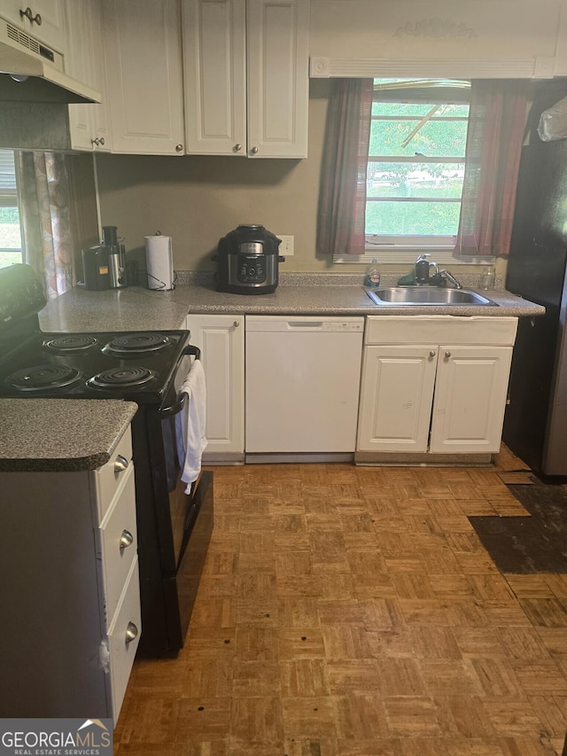 100 Brookwood Dr, Warner Robins, GA 31088 - kitchen with a sink, freestanding refrigerator, white dishwasher, under cabinet range hood, and black / electric stove