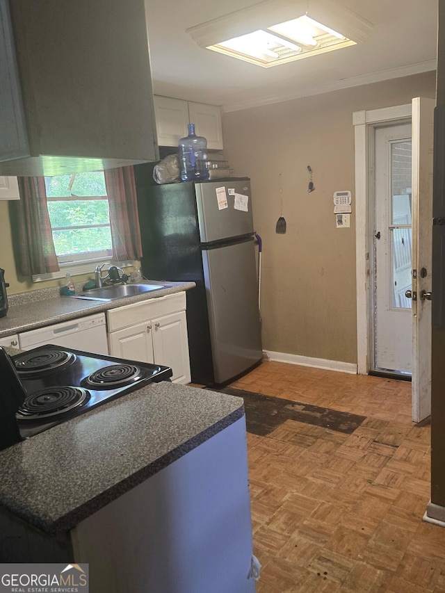 100 Brookwood Dr, Warner Robins, GA 31088 - kitchen featuring dark countertops, black electric range, a sink, and white cabinets