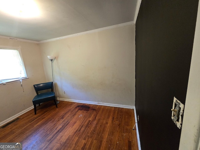 100 Brookwood Dr, Warner Robins, GA 31088 - unfurnished room with visible vents, wood finished floors, ornamental molding, and baseboards