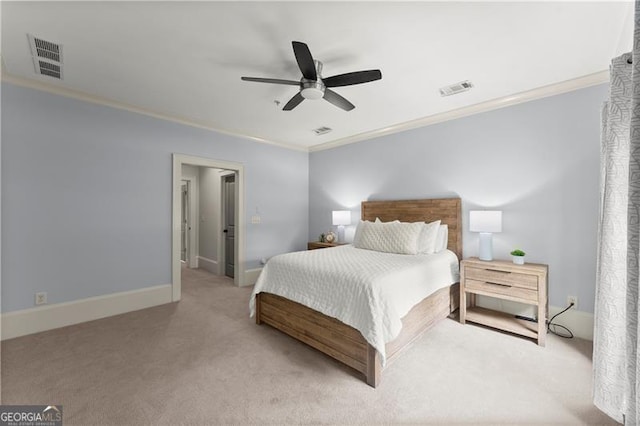 bedroom with crown molding, ceiling fan, carpet, and visible vents