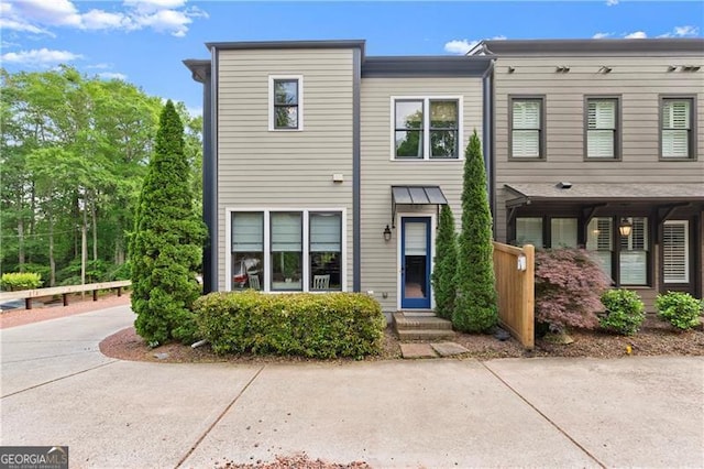 multi unit property with concrete driveway and entry steps