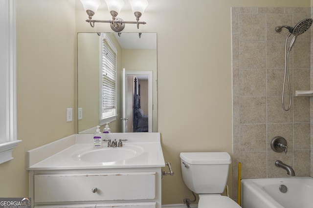 bathroom featuring toilet, shower / tub combination, and vanity