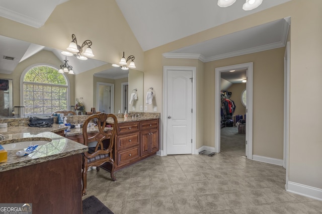 bathroom featuring a notable chandelier, a sink, visible vents, double vanity, and vaulted ceiling
