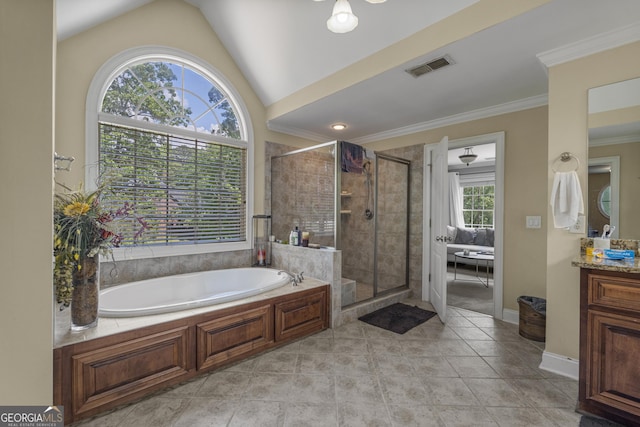 bathroom featuring a garden tub, visible vents, a shower stall, vanity, and lofted ceiling