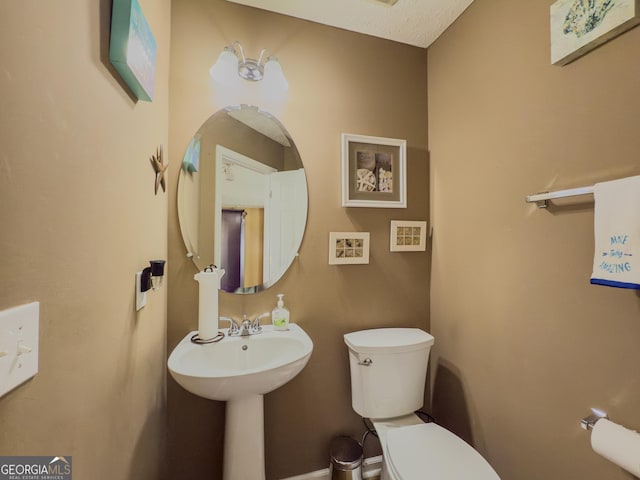 bathroom featuring toilet