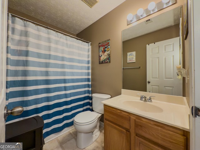 full bath with a textured ceiling, vanity, toilet, tile patterned flooring, and visible vents