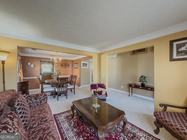 carpeted living room with baseboards, a notable chandelier, and ornamental molding