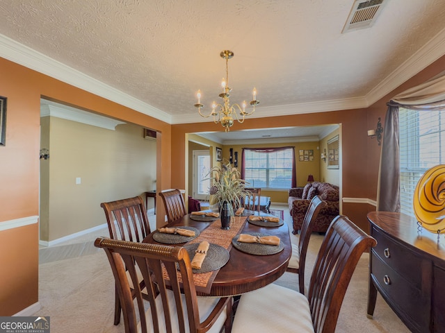 dining room featuring light carpet, baseboards, visible vents, a chandelier, and ornamental molding