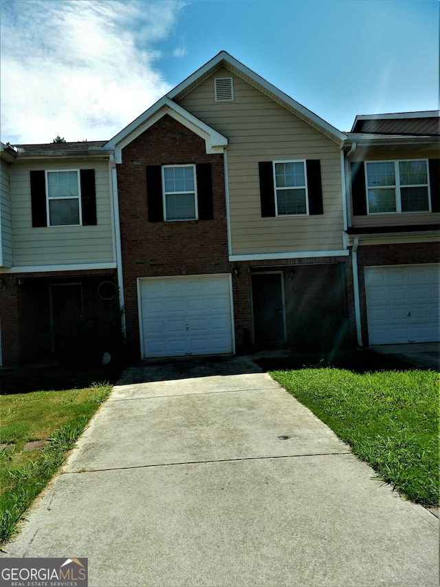 615 Magnolia Gardens Walk, Mcdonough, GA 30253 - townhome / multi-family property featuring brick siding, an attached garage, and concrete driveway