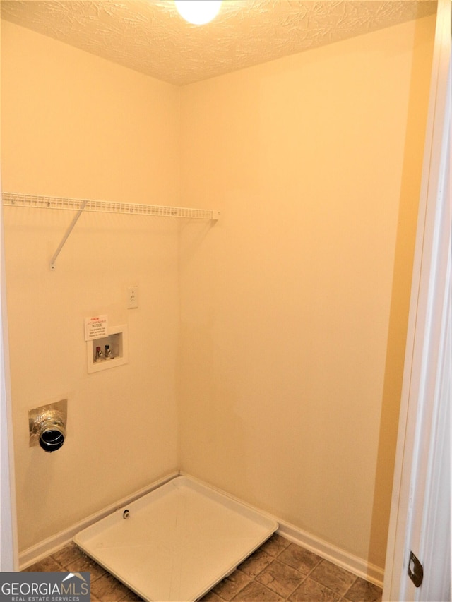 615 Magnolia Gardens Walk, Mcdonough, GA 30253 - washroom featuring baseboards, a textured ceiling, laundry area, and hookup for a washing machine