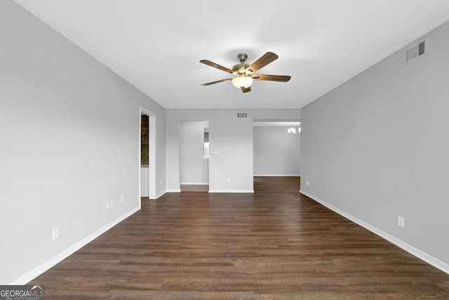 unfurnished room featuring visible vents, baseboards, and ceiling fan
