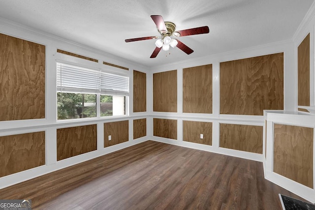 spare room featuring crown molding, a ceiling fan, and wood finished floors