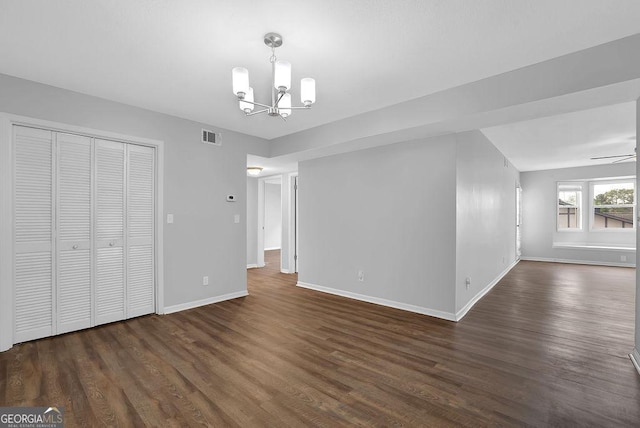 6851 Roswell Rd Unit C7, Atlanta, GA 30328 - unfurnished dining area featuring baseboards, visible vents, dark wood-style floors, and ceiling fan with notable chandelier
