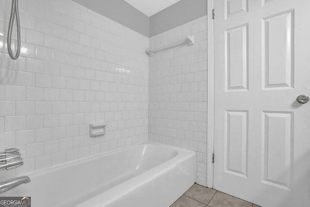 bathroom with tub / shower combination and tile patterned flooring